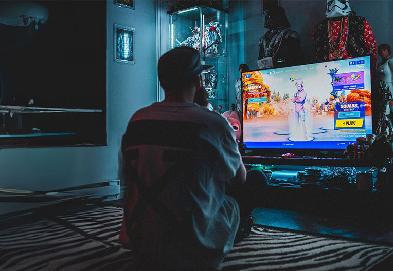 Man playing a game in his bedroom